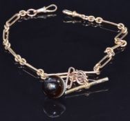A 9ct rose gold double Albert made up of elongated and oval links (38g) with a banded agate fob,