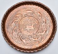 Arts and Crafts copper charger in the Newlyn style, hand worked with hammered decoration of fish and