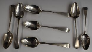Seven Georgian Old English pattern hallmarked silver table spoons, various dates and makers,