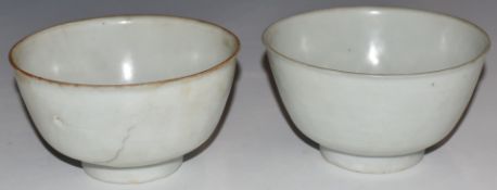 Two Chinese Kangxi period pedestal bowls with ivory glaze, from the Vung Tau cargo, with original