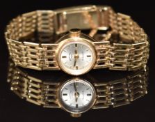 Rotary 9ct gold ladies wristwatch with gold hands and hour markers, silver dial and 21 jewel