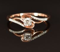 A 9ct rose gold ring set with diamonds in a twist setting, size M, 1.8g