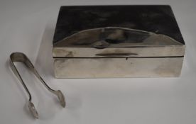 Hallmarked silver cigarette box, width 13cm together with a pair of hallmarked silver sugar tongs,