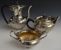 Walker & Hall George V hallmarked silver three piece tea set with reeded lower bodies, Sheffield