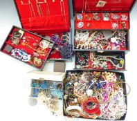 A collection of costume jewellery including brooches, necklaces, etc