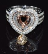 An 18ct gold ring set with baguette and round cut diamonds, with a loose 0.7ct round brilliant cut