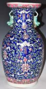 Chinese polychrome enamelled vase with twin figural handles, H38cm
