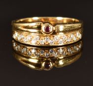 An 18ct gold ring set with a ruby and diamonds, size M/N, 4.3g