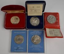 Three cased Western Samoa silver proof crown sized coins commemorating The Olympic Games 1976 and