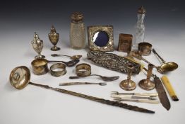 Hallmarked silver items to include pair of napkin rings and further napkin ring, pair of peppers,