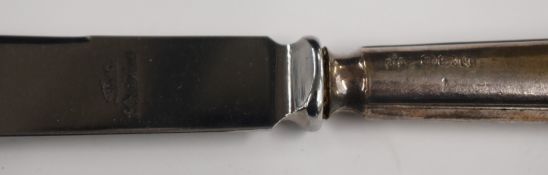 Hallmarked silver items comprising teaspoon, cased napkin ring, further napkin ring and an anointing