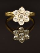An 18ct gold ring set with diamonds in a cluster, total diamond weight 1ct, size L, 3.8g