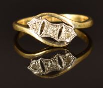 An18ct gold ring set with three diamonds in a platinum setting, size J, 2.1g