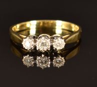 An 18ct gold ring set with three diamonds, size P/Q, 3.1g