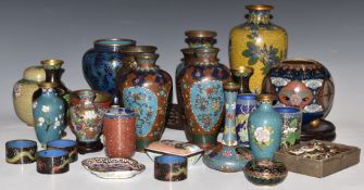A large collection of Chinese and Japanese cloisonné and other vases, napkin rings, pill boxes