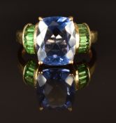 A 9k gold ring set with fluorite and tsavorite garnets, size L, 3.1g