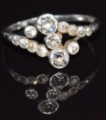 Edwardian platinum ring set with diamonds in a twist setting, in a vintage box, size O, 2.6g