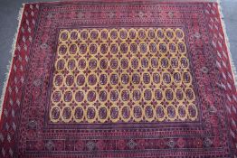 Turkoman large rug on wine ground, 273 x 350cm