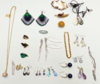 A collection of costume jewellery including a silver brooch set with malachite, silver earrings, etc