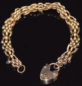 A 9ct rose gold bracelet with heart padlock, 12.1g