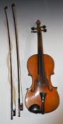 Early to mid 20thC violin with 36cm two piece back, unlabelled, together with two bows, tutor book