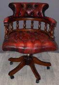Oxblood red leather upholstered captain's or office chair