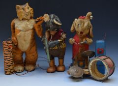 Three battery operated children's toys comprising walking Tiger by Marx, Mambo the Elephant by
