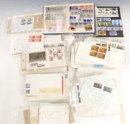 A quantity of UK stamp covers and pre-decimal stamp booklets and 1960s first day covers, some
