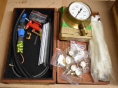 Model steam engine pressure gauges comprising six small and one large Reeves examples, hand pump,