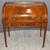 Victorian inlaid mahogany roll top desk with fitted interior and gallery top raised on tapering
