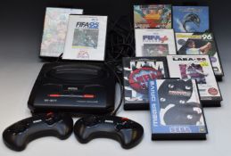Sega Mega Drive II games console with two controllers and nine games including Echo The Dolphin, NBA