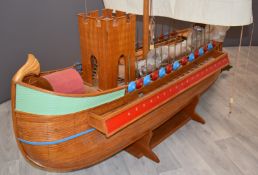A scratch built model of a Roman ship or quadriremes with single mast, castellated bridge, oars,