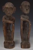A pair of carved African tribal figures, H35cm