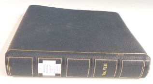 The Kennedy memorial stamps collection in a blue folder