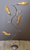Shopfitting / haberdashery vintage glove display stand with four wooden articulated hands on a