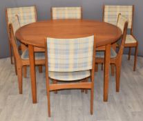 Danish retro teak circular extendable table and six upholstered chairs, diameter 129cm,
