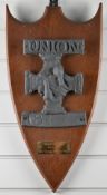 A lead union fire mark (double hand in hand) mounted on a mahogany shield, H27cm
