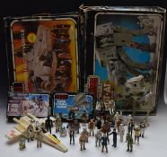 A collection of vintage Star Wars toys including The Millennium Falcon, AT-AT Walker, AT-ST, X-