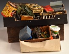 A large collection of loose Meccano parts including motors, wheels, pulleys and instruction