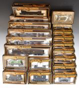 Twenty Mainline 00 gauge model railway wagons and vans, all in original boxes.