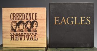 CDs - Creedence Clearwater Revival six CD box set, and Eagles seven CD box set, both appear EX