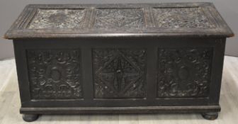 19thC carved oak trunk or coffer raised on bun feet, W132 x D61 x H60cm
