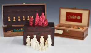 A weighted boxwood chess set with ivory chess pieces, in a wooden cigar box, height of king 9.8cm