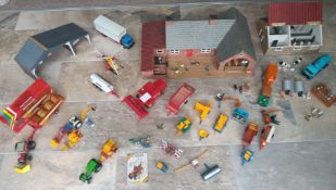A collection of Britains farm buildings, vehicles and figures together with a Tomy Palitoy Big