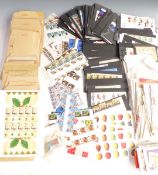A large quantity of mint GB QEII commemorative stamps, singles, blocks, gutter strips, traffic