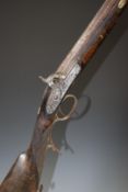 Unnamed percussion hammer action rifle with engraved locks, hammer, scrolling trigger guard and butt