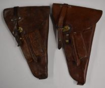 Two Swedish leather pistol holders both stamped with three crowns, with cleaning rods