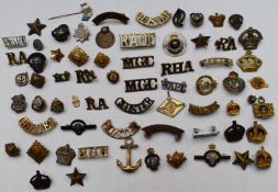 Collection of military badges and shoulder titles including Royal Navy, Royal British Legion,