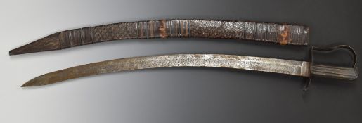 North African sword with 74cm curved blade and leather scabbard. PLEASE NOTE ALL BLADED ITEMS ARE