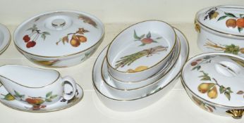 Approximately twenty nine pieces of Royal Worcester dinner ware decorated in the Evesham Gold